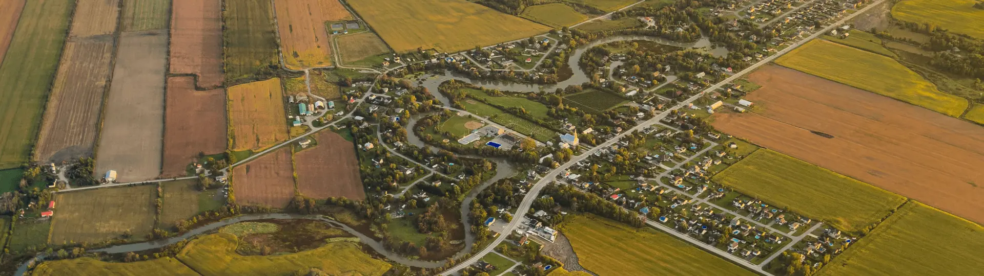 Aerial view of rural Canadian community and farmland